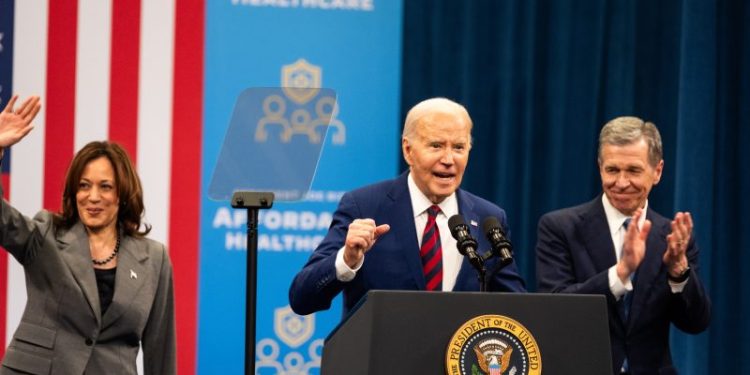 Biden plays up his money edge in taking feistier shots at Trump