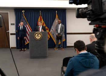 Federal officials say 20 have been charged for threatening election workers