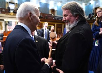 This patient Republican has Biden by the ear, one night a year