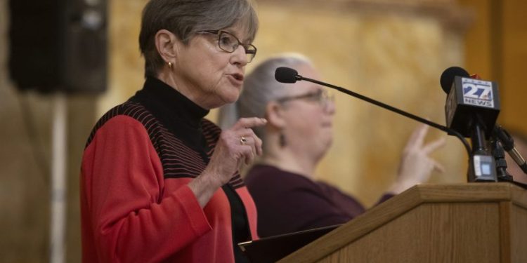 Kansas governor vetoes a ban on gender-affirming care; GOP vows override