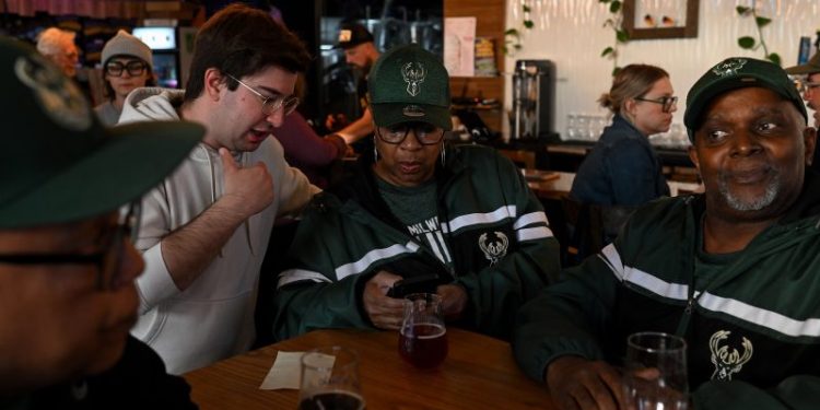 Bingo, beaded bracelets and volunteer iPhones power Biden’s organizing effort