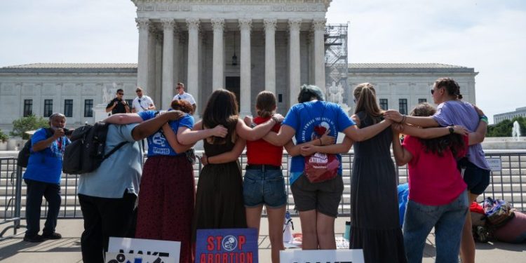 Supreme Court would allow emergency abortions for now, early opinion says