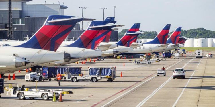 Delta cancels hundreds more flights as DOT opens probe