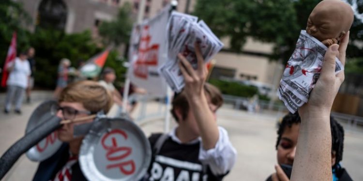 Mostly absent on GOP convention stage: Abortion, gun rights and Reagan