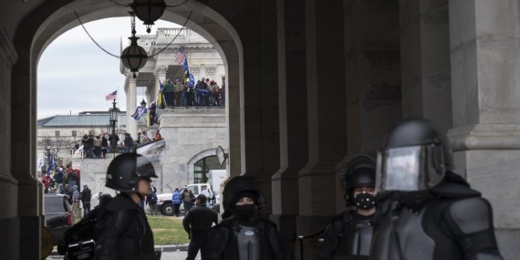 He joined the force after allegedly storming the Capitol. He was just arrested.
