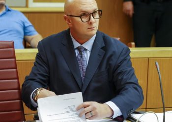 Ex-congressional candidate charged with threatening ‘hit squad’ against opponent