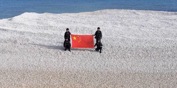 China and Philippines unfurl competing flags on disputed South China Sea sandbars, reviving tensions